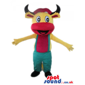 Yellow bull with big round eyes and black horns and a red belly