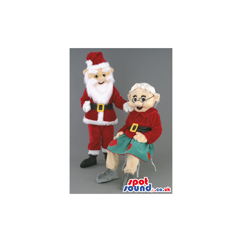 Grandmother And Santa Claus Mascots With Green And Red Garments