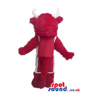 Red bull with white horns and a white nose wearing red boots -