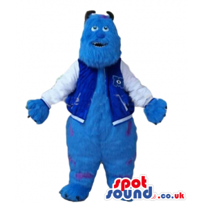 Blue furry monster with brown horns and claws and violet dots -