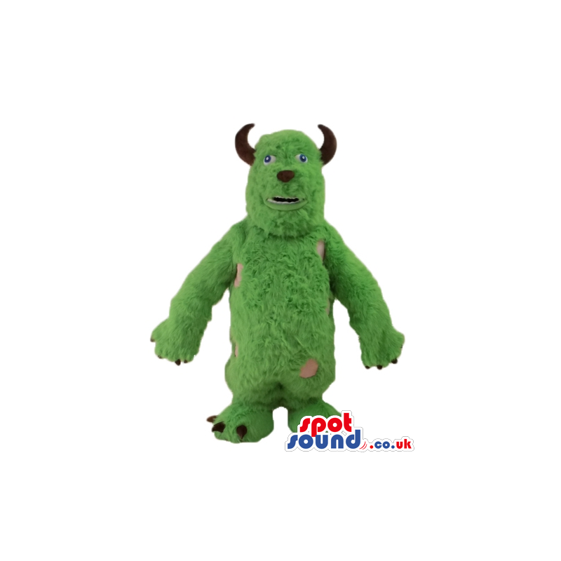 Green furry monster with small eyes and small brown horns -