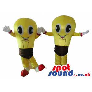 2 smiling yellow and brown light bulbs with big round eyes, and