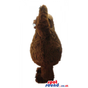 Fierceful brown bear with sharp white teeth - Custom Mascots