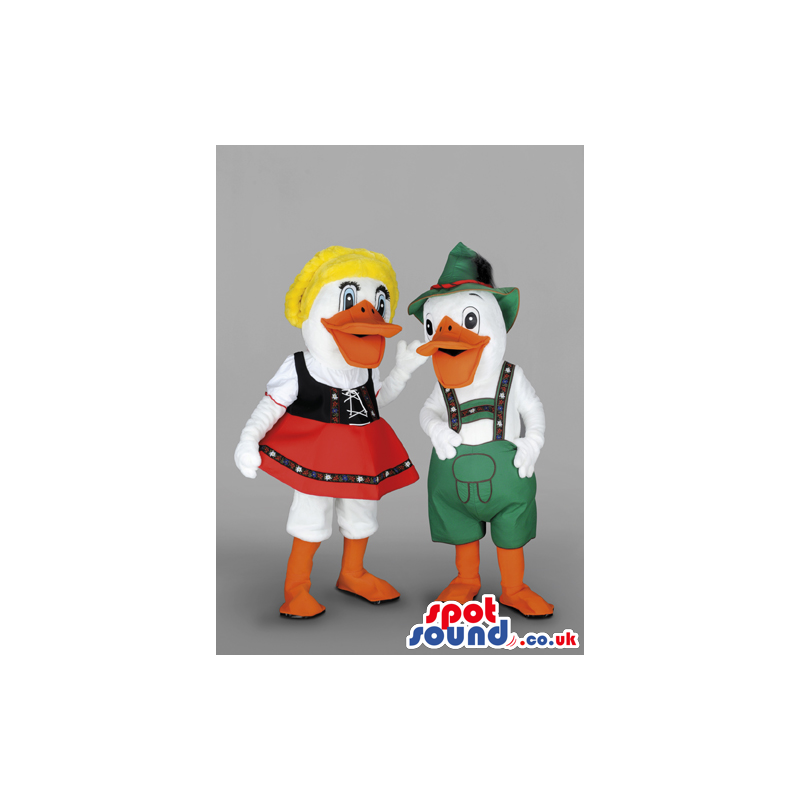 A Couple Of Ducks In Tirol Dresses With Red Skirt, Green Hat -