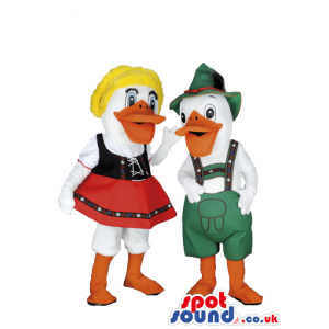 A Couple Of Ducks In Tirol Dresses With Red Skirt, Green Hat -