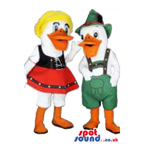A Couple Of Ducks In Tirol Dresses With Red Skirt, Green Hat -
