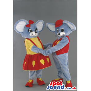 A Couple Of Mice Mascots Wearing Yellow And Red Garments -