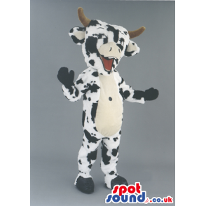 Black And White Cow Animal Mascot With Horns And A Happy Smile