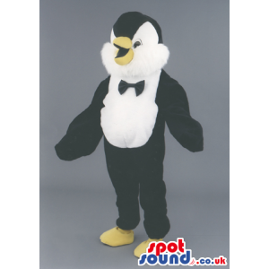 Penguin Polar Animal Mascot With A Black Bow Tie And Yellow