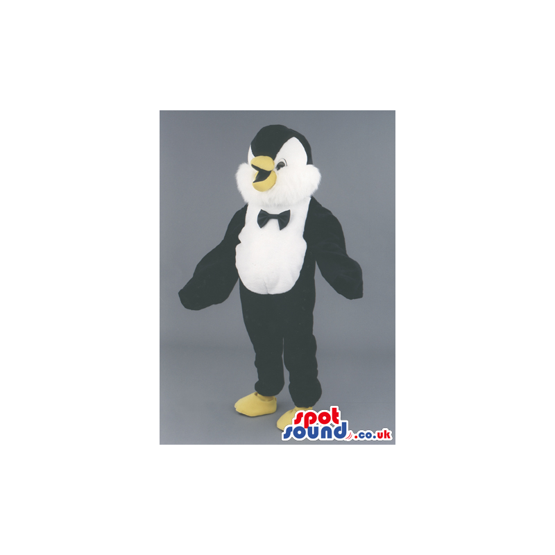 Penguin Polar Animal Mascot With A Black Bow Tie And Yellow