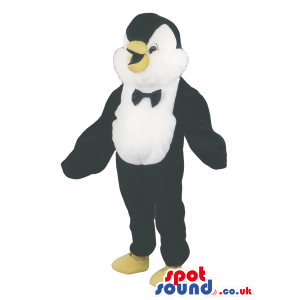 Penguin Polar Animal Mascot With A Black Bow Tie And Yellow