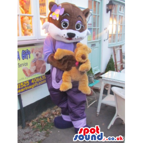 Girl Pussy Cat Animal Mascot With Purple Clothes And A Ribbon -