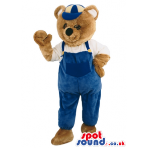 Brown Bear Animal Mascot Wearing Blue Overalls And A Cap -