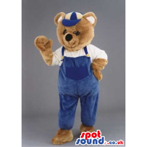 Brown Bear Animal Mascot Wearing Blue Overalls And A Cap -