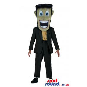 Frankenstein Iconic Character Mascot With Suit And Big Teeth -