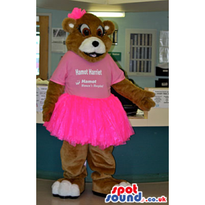 Brown Bear Animal Mascot Wearing A Pink Skirt And T-Shirt -