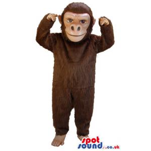 Monkey mascot in brown colour with bare foot looking at you -