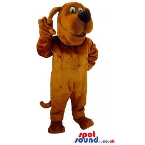 Scooby dog mascot waves hand for us & with smile in his face -