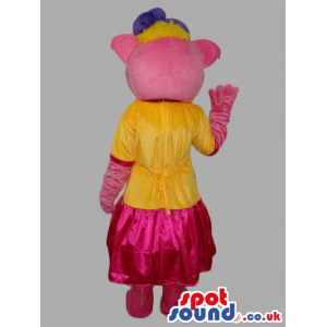 Pink Bear Fantasy Mascot Wearing Pink Dress And Purple Ribbon -