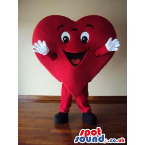 Dancing Lovely red heart mascot with an attractive face -