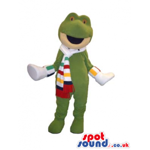 Green Frog Animal Mascot Wearing A Striped Scarf And Shoes -