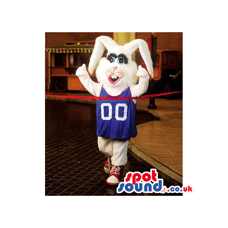 White Rabbit Mascot Wearing A Blue T-Shirt And Sports Sneakers