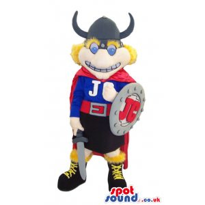 Viking Mascot Wearing A Cape, Shield And Helmet With Horns -