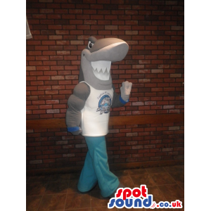 Shark Mascot With Strong Muscles Wearing Sports Clothes -