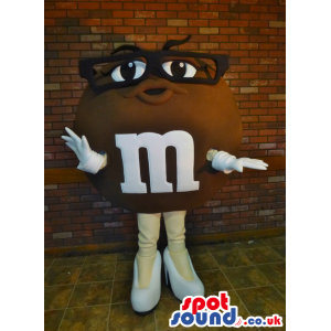 Brown M&M'S Character Mascot Wearing Glasses And High Heels -