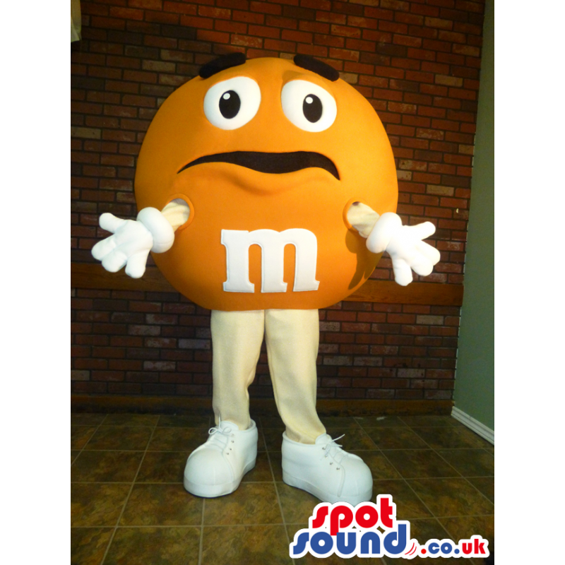 Yellow M&M'S Character Mascot With Funny Face And Sneakers - Yellow M&M'S Character Mascot With Funny Face And Sneakers -