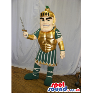 Gladiator Human Mascot Wearing Green And Golden Armor And A
