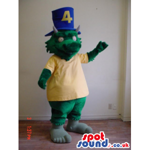 Green Dragon Mascot Wearing A Yellow T-Shirt And A Blue Top Hat