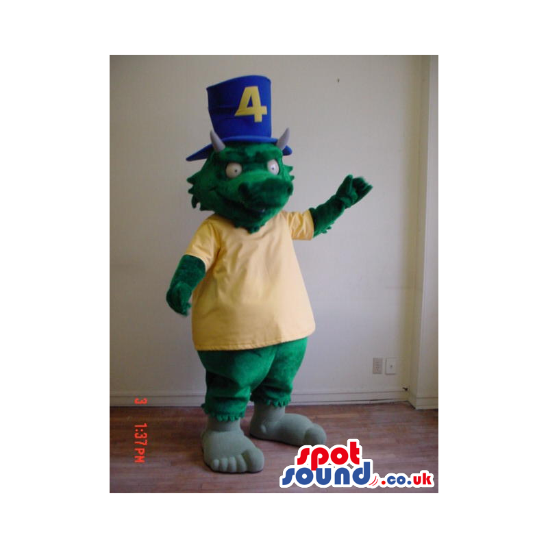 Green Dragon Mascot Wearing A Yellow T-Shirt And A Blue Top Hat
