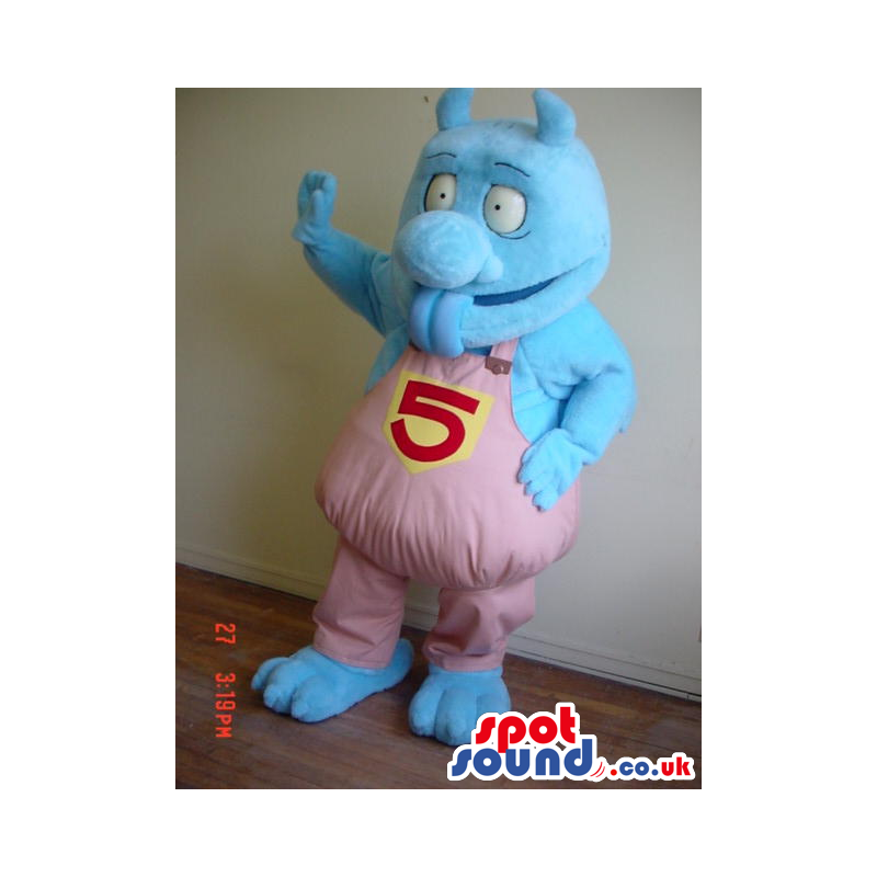 Blue Monster Mascot Wearing Pink Overalls With Number 5 -