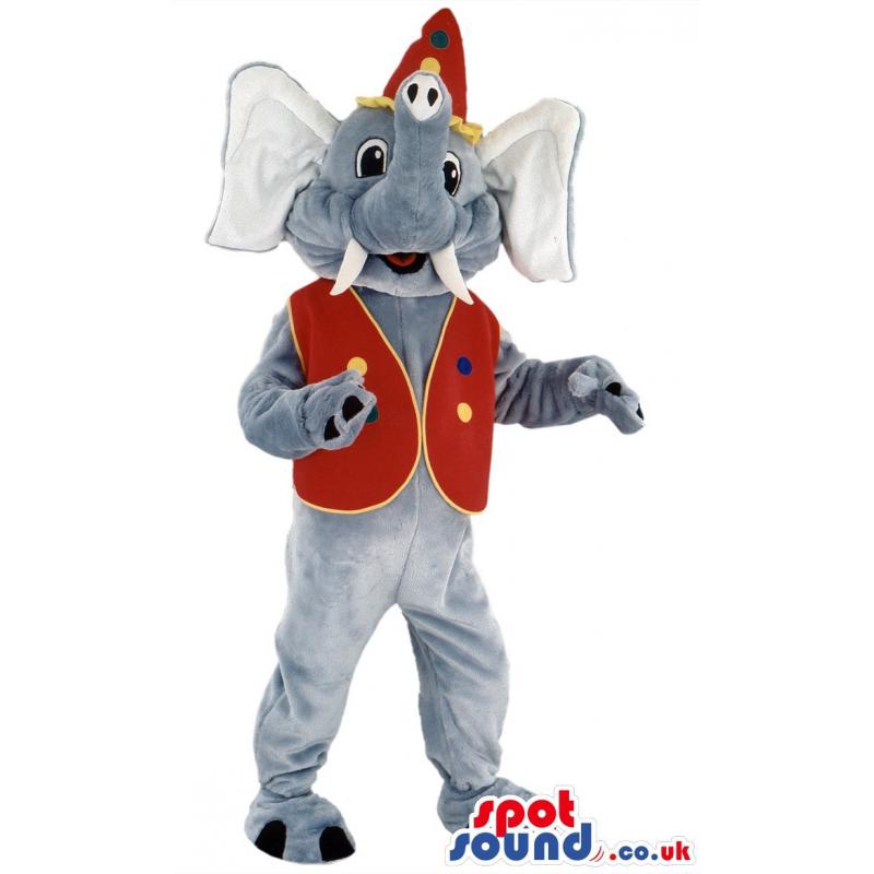 Elephant mascot with a tusk standing & smiling with red coat -