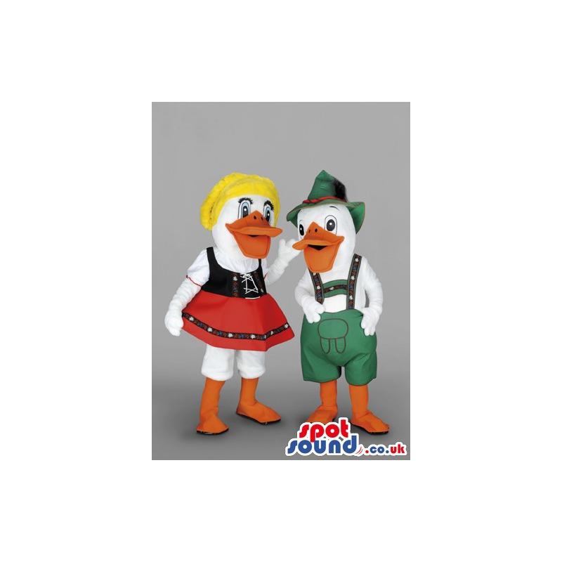 Couple white male duck with a green jumper & woman with red
