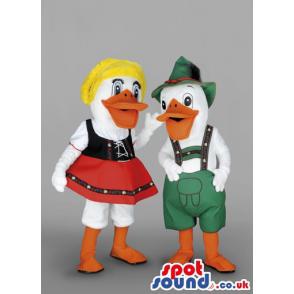 Couple white male duck with a green jumper & woman with red