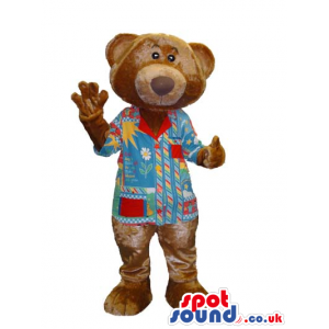 Customizable Brown Bear Mascot Wearing A Colorful Shirt -