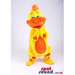 Yellow and orange crocodile mascot dancing with a nice smile -