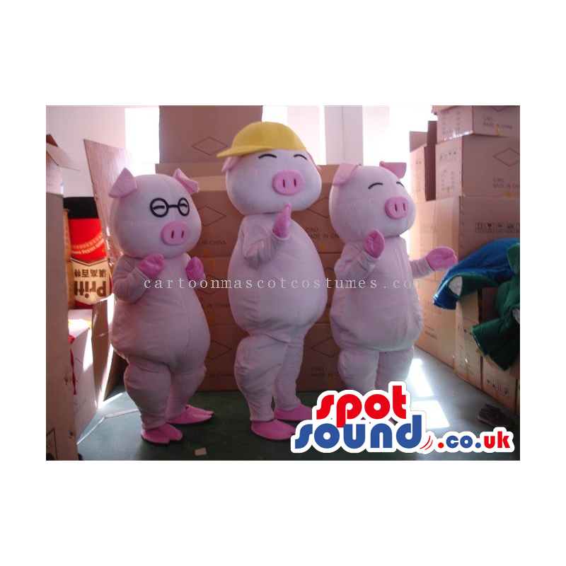 Three Pig Mascots With Different Sizes And Garments - Custom