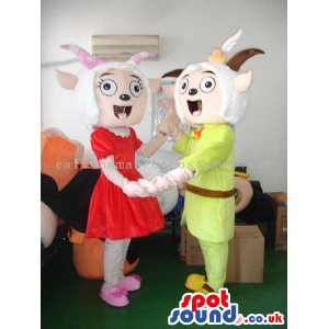 Goat Couple Mascots Wearing Special Boy And Girl Garments -