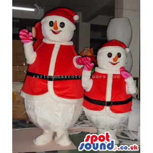 Two Snowmen Christmas Mascots Wearing Santa Claus Garments -