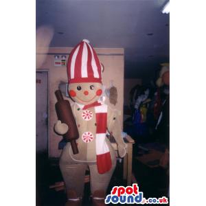 Chef mascot with rolling pin and peculiar hat in his head -