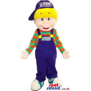 Blond Boy Funny Mascot Wearing Blue Overalls And A Striped