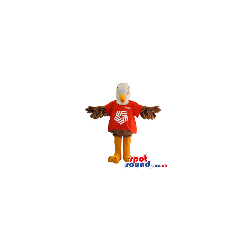 White And Brown Eagle Mascot Wearing A Red T-Shirt With A Logo