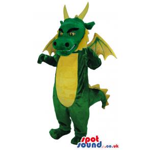 Big green and yellow friendly dragon mascot with red hair -