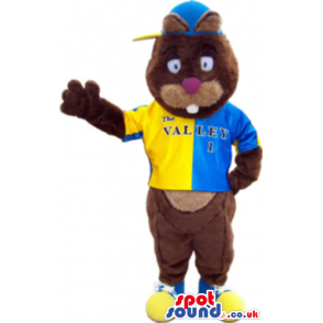 Brown Bear Animal Mascot Wearing Yellow And Blue Clothes -