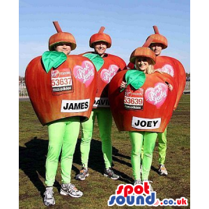 Four Red Apple Group Mascots Or Costumes With Text And Logos -