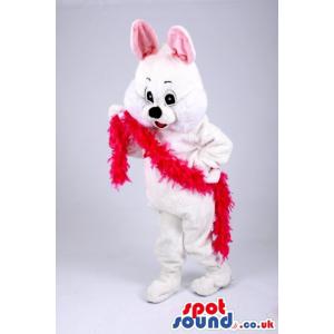 White rabbit mascot with a pink ear and red wool in his hand