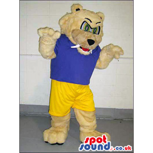 Beige Angry Bear Mascot Wearing A Blue T-Shirt And Yellow